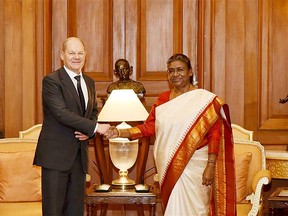 This handout photo taken and released by Indian Press Information Bureau (PIB) on February 25, 2023 shows India's President Droupadi Murmu (R) meeting with German Chancellor Olaf Scholz at India's presidential palace Rashtrapati Bhavan in New Delhi. (Photo by PIB / AFP)