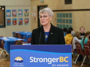 B.C. Finance Minister Katrine Conroy at a news availability after serving lunch for students at Ruth King elementary school in Langford on Monday, as part of a photo-op a day prior to the unveiling of the new provincial budget set for Tuesday, Feb. 28, 2023.