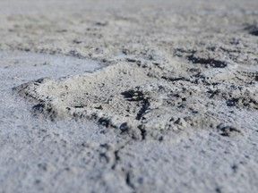 A dust spot uncovered by erosion is seen on the dried out lakebed of Farmington Bay of the Great Salt Lake near Syracuse, Utah, U.S., July 1, 2022. REUTERS/Nathan Frandino