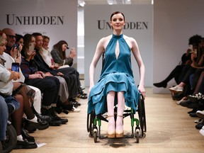 A model presents a creation during the "Unhidden: A New Era in Fashion" catwalk show, with designs presented by models who all live with a disability, chronic condition or visible difference, during London Fashion Week in London, Britain, February 17, 2023. REUTERS/Henry Nicholls