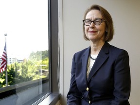 FILE - Oregon Attorney General Ellen Rosenblum poses for a photo at her office in Portland, Ore., on July 13, 2016. Rosenblum announced Friday, Feb. 10, 2023, that the Criminal Division of her agency, the Oregon Department of Justice, is opening a criminal investigation into the matter involving ethics violations related to the purchase of liquor by some staff of the Oregon Liquor and Cannabis Commission and possibly others.