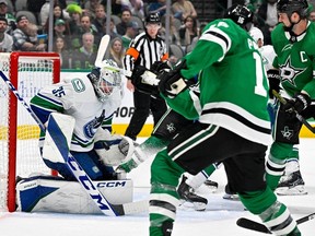 Vancouver Canucks goaltender Thatcher Demko (35) stops a shot by Dallas Stars centre Joe Pavelski (16) during the second period at the American Airlines Center on Monday.