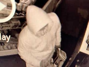 Kelowna RCMP released this photo of a suspect who broke into Players Choice Sports in downtown Kelowna and made off with at least $30,000 worth of goods, including a signed Wayne Gretzky Racers jersey.