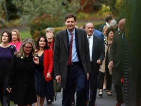 Premier David Eby arrives with ministers before the start of the swearing-in ceremony at Government House in Victoria, B.C., on Wednesday, Dec. 7, 2022. B.C. politicians are returning to the legislature for the spring sitting, starting with a throne speech laying out the government's goals for the months ahead.