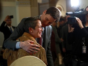 Former minister of tourism Melanie Mark announces her resignation as she is joined by Premier David Eby during a news conference earlier this week.