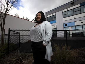 Lenya Wilks poses for a photo in Surrey, B.C. on Tuesday, Feb. 21, 2023. Wilks says she felt like the "only Black person in Surrey" when she first moved to the city east of Vancouver last year. But the Black population in the region is growing fast and residents who who once might have left in search of community are increasingly staying to forge their own, says Wilks, senior manager of the Surrey Local Immigration Partnership.