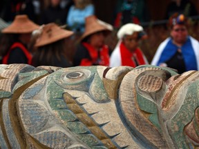 Family, friends and hereditary chiefs gathered to witness the historical repatriation of the Nuxalk Nation totem pole carved by the late Louie Snow after years of effort to release the pole back to the nation from the Royal B.C. Museum during a ceremony in Victoria on Monday.