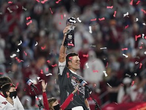 Tampa Bay Buccaneers quarterback Tom Brady holds up the Vince Lombardi trophy after defeating the Kansas City Chiefs in the NFL Super Bowl 55 football game, Feb. 7, 2021, in Tampa, Fla.