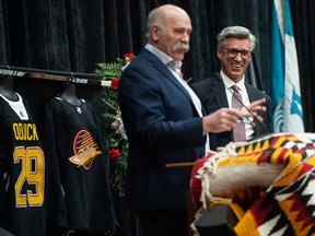 Dave Babych (left) and Russ Courtnall speak on behalf of the Canucks Alumni to several hundred people at a celebration of life for former Vancouver Canucks player Gino Odjick at the Musqueam Community Centre in Vancouver, B.C., Saturday, February 4, 2023. (Photo by Jason Payne/ PNG)