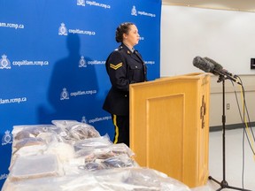 RCMP Cpl. Alexa Hodgins with proceeds of the recent drug investigation.