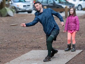 Athal Christie of the North Shore Disc Golf Club with daughter Quinn, 6, at Eastview Park in North Vancouver on Wednesday, February 22, 2023.
