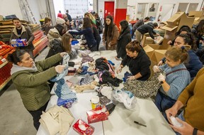 Volunteers in Vancouver sort and pack clothing donations for survivors of the earthquake that devastated parts of Turkey and Syria on Monday.