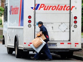 A Purolator truck parked illegally to make a package delivery in Vancouver.