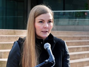 The Narwhal and freelance photojournalist Amber Bracken holds a news conference to announce the filing of a lawsuit for wrongful arrest and breach of liberty and press freedom rights, at BC Supreme Court in Vancouver BC., on February 13, 2023.