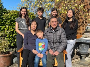 Undated handout photo of Francis Tran (bottom right) with his wife and grandkids: (from left to right)
Keeley, Jesse, Kenzi, Annika (standing). 
Seated are his wife Linda, and youngest grandson Oakland.