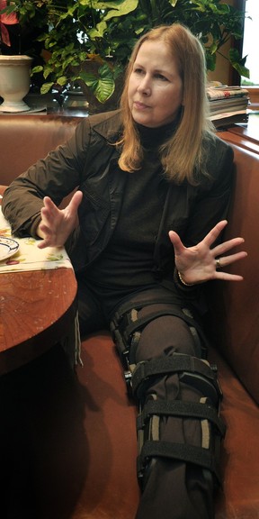 Carolyn Cross in a knee brace more than two months after the crash.