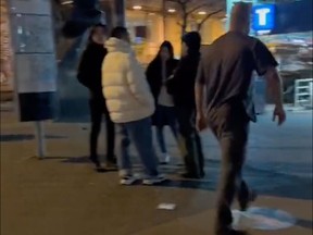 A screenshot from a Tiktok video posted on social media depicting a homophobic tirade by a man outside Burrard SkyTrain station.