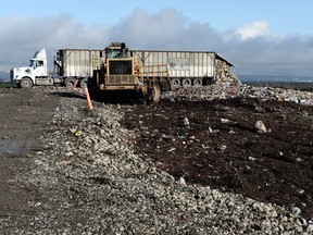 A truck dumps tonnes of trash at the Vancouver Landfill in Delta.
