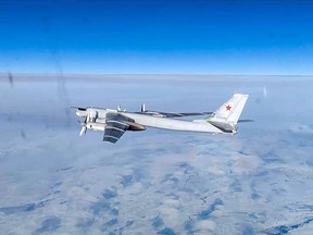 In this handout photo taken from video released by Russian Defense Ministry Press Service on Tuesday, Feb. 14, 2023, A Tu-95 strategic bomber of the Russian air force is seen from another one during their mission. Two Russian Tu-95 strategic bombers flew a patrol mission over the Bering Sea. THE CANADIAN PRESS/AP-Russian Defense Ministry Press Service via AP