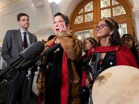 Melanie Mark, British Columbia's first First Nations cabinet minister, wipes a tear away on Wednesday as she announces she will be resigning her Vancouver-Mount Pleasant seat in the B.C. legislature.