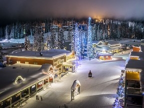 The town of Silver Star Mountain Resort lit up at night.