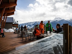 A group of skiers at Revelation Lodge at Revelstoke Mountain Resort.  andrew strain