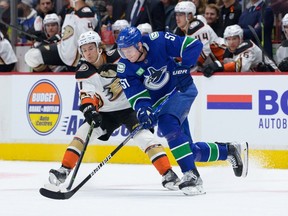 Anaheim's Trevor Zegras (left), jostling with Canucks blueliner Tyler Myers earlier this season, leads the Ducks in goals, but had scored just once in his last 10 games heading into action Tuesday night in Seattle against the Kraken.