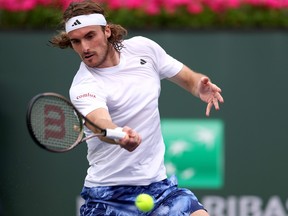 Stefanos Tsitsipas of Greece hits a forehand in a three set loss to Jordan Thompson of Australia during the BNP Parisbas at the Indian Wells Tennis Garden on March 10, 2023 in Indian Wells, California.
