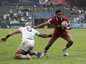 The Canadian men lost their opening match at the Cathay/HSBC Hong Kong Sevens rugby tournament on Friday, beaten 17-7 by Argentina. Canada's Josiah Morra breaks away from Argentina's Agustin Fraga's tackle during the first day of the tournament in Hong Kong, Friday, March 31, 2023.