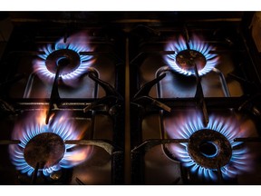 Gas rings burn on a domestic oven hob in the Molins de Rei district of Barcelona, Spain, on Thursday Sept. 23, 2021. Energy prices are soaring from the U.S. to Europe and Asia as economies emerge from the pandemic and people return to the office. Photographer: Angel Garcia/Bloomberg