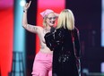 Avril Lavigne confronts a topless protester as she presents during the Junos Monday, March 13, 2023.