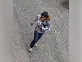Vancouver police released this surveillance image of a woman who allegedly set a fire in an alley behind the Chinese Cultural Centre on East Pender Street.