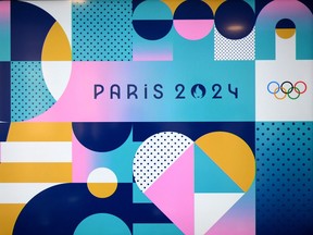 This photograph taken on February 8, 2023, shows the logo, dominant colours and visual identity for the Paris 2024 Olympic and Paralympic Games, during the presentation of the event's designs, in Saint-Denis, north of Paris.
