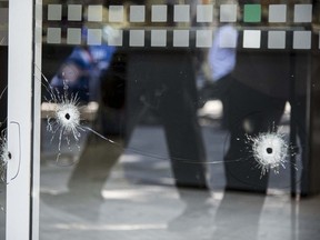 Picture of bullet holes in a window of a supermarket belonging to the family of Antonela Roccuzzo, the wife of Argentine football star Lionel Messi, after attackers fired shots at the facade of the closed premises early in the morning and left a threat message to Messi, in Rosario, Santa Fe Province, Argentina, on March 2, 2023.