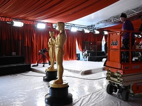 An Oscar statue is seen on the champagne carpet in the celebrity arrivals area as preparations are underway for the 95th Oscars in Hollywood, California, on March 9, 2023. (Photo by Robyn BECK / AFP)