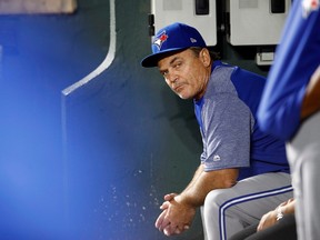 Toronto Blue Jays manager John Gibbons sits in the dugout in the third inning of a baseball game against the Baltimore Orioles, Monday, Sept. 17, 2018, in Baltimore.