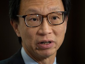 Senator Yuen Pau Woo, facilitator of the Independent Senators Group (ISG) speaks with the media in the foyer of the Senate in Ottawa on Thursday Nov. 28, 2019. Woo questions whether a foreign influence registry might become "a modern form of Chinese exclusion," and says angry reaction to his suggestion proves his point about racial profiling and stigmatization. THE CANADIAN PRESS/Adrian Wyld