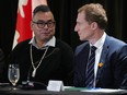 Former Tk'emlúps te Secwépemc chief Shane Gottfriedson, left, and federal Minister of Crown-Indigenous Relations Marc Miller talk before a news conference, in Vancouver, on Saturday, January 21, 2023. The federal government says it's come to a $2.8-billion agreement to settle a class-action lawsuit brought by two British Columbia first nations related to the collective harms caused by residential schools. The deal was signed with plaintiffs representing 325 members of the Gottfriedson Band that opted into the suit.