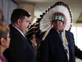 Chief Clinton Key (right) of the Key First Nation, and elected councillor Solomon Reece attend a news conference about the launch of consultations regarding Bill C-92, federal legislation that re-affirms the rights of Indigenous communities to establish and provide their own child welfare services, in Vancouver, on Tuesday, March 21, 2023.
