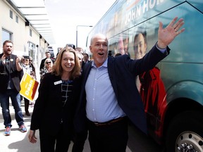 John Horgan and Mitzi Dean meet with supporters during a campaign stop in Victoria on April 28, 2017. Dean, the child and family development minister, says families fostering kids 11 and under will see their payments increase by $450 a month to $1,465 per child, while caregivers for those 12 to 19 will see a $531 monthly increase to $1,655 per child.