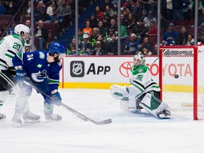 Dallas Stars defenceman Ryan Suter (20) watches as Vancouver Canucks forward Phillip Di Giuseppe (34) scores on goalie Matt Murray (32) in the first period at Rogers Arena.