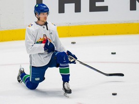 Vancouver Canucks forward Elias Pettersson (40) wears the Pride jersey during warm-up prior to a game against the Washington Capitals at Rogers Arena on March 11, 2022.