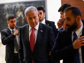 Israeli Prime Minister Benjamin Netanyahu leaves his office in the Knesset, Israel's Parliament, in Jerusalem, March 15, 2023.