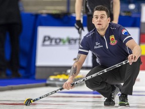 Team McEwen lead Colin Hodgson throws against Team Jacobs during Draw 16 of the 2021 Canadian Olympic curling trials in Saskatoon, Friday, November 26, 2021.