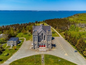An aerial photo of St. Bernard Roman Catholic Church in St. Bernard, N.S., on the province's southwestern coast, is seen in an undated handout photo. The deconsecrated church is being sold for an asking price of $250,000, though it will require extensive repairs, says the former church treasurer, Suzanne Lefort.