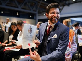 The Liberals are downplaying the citizenship ceremony that many say is essential to building healthy pride in Canada. That's not all they've done to diminish citizenship. (Photo: Tareq Hadhad at an oath of citizenship ceremony.)