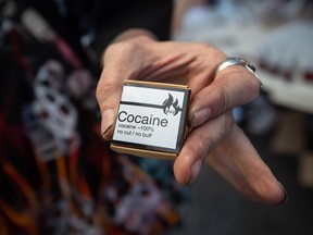 Martin Steward holds cocaine he received from the Drug User Liberation Front, which was handing out a safe supply of illicit drugs in the Downtown Eastside to mark the five-year anniversary of B.C. declaring a public health emergency in the overdose crisis on April 14, 2021. Health Canada has granted a Langley cannabis company the right to possess, produce, sell and distribute cocaine.