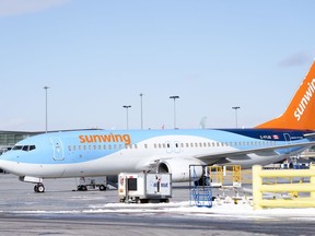 A Sunwing aircraft is parked at Montreal Trudeau airport in Montreal on Wednesday, March 2, 2022.&ampnbsp;