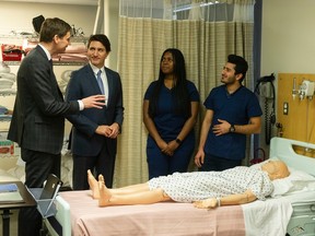 B.C. Premier David Eby and Prime Minister Justin Trudeau tour the nursing training area at Kwantlen Polytechnic University in Langley on, March 1, 2023.