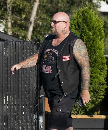 A member of the Hells Angels arrives at the Nanaimo Hells Angels' clubhouse in Nanaimo, BC, July, 20, 2018.
